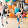 Fitness class exercising in the studio at the gym